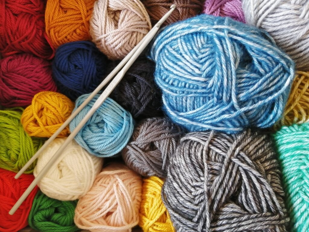 colorful balls of wool stacked upon each other